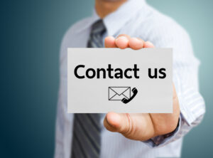 Businessman showing contact us card
